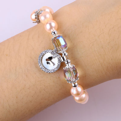 7 มิลลิเมตร สร้อยข้อมือสีชมพู Pearl Stretch With White Shell ยอมรับการปรับแต่ง