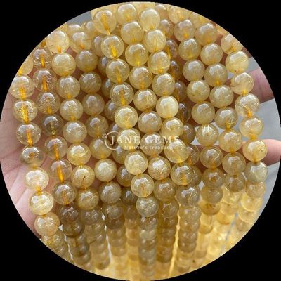 หินแท้เคลือบตัดกลม ไฟควาร์ทส ทอง Rutilated Quartz กลีบข้อมือสําหรับการทําเครื่องประดับ DIY